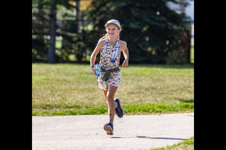 Emily Molzan sprints up a Crystal Shores pathway in the Terry Fox Run on Sept. 17. With over 130 participants racing, the event raised just over $5,000 for the Terry Fox Foundation.