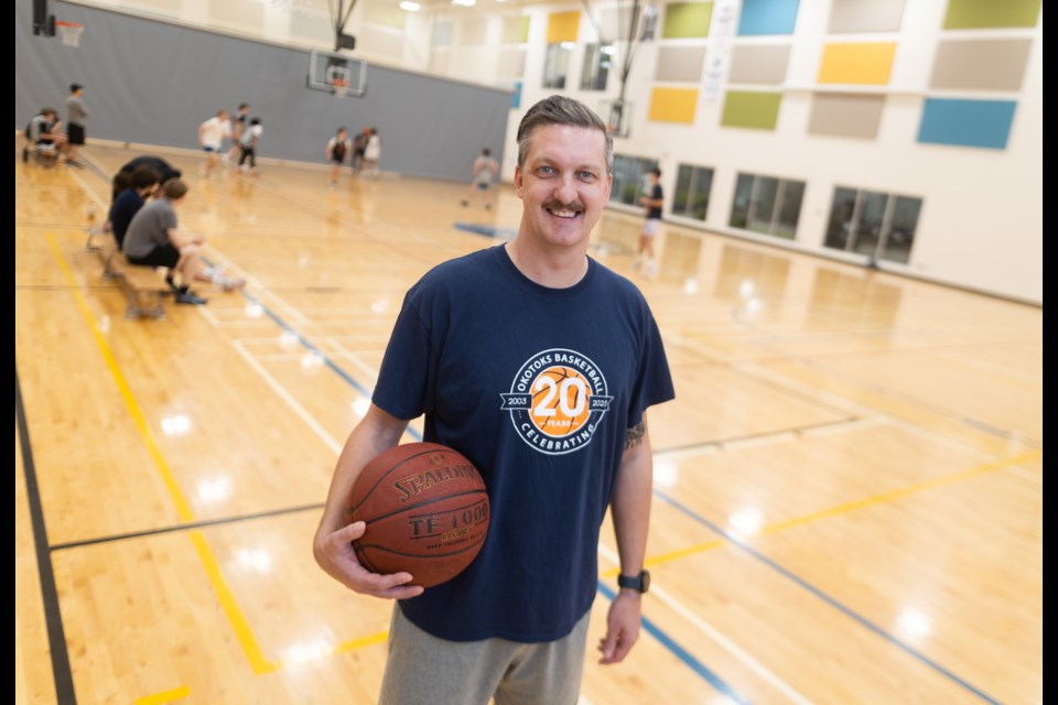 Blake Husky, president of the Okotoks Basketball Association, poses for a portrait during a practice at Meadow Ridge School on Oct. 12.