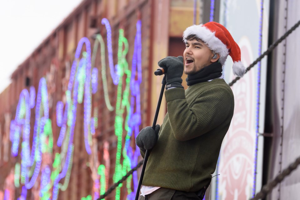 Tyler Shaw performs during the CPKC Holiday Train stop in Okotoks on Dec. 11, 2023.