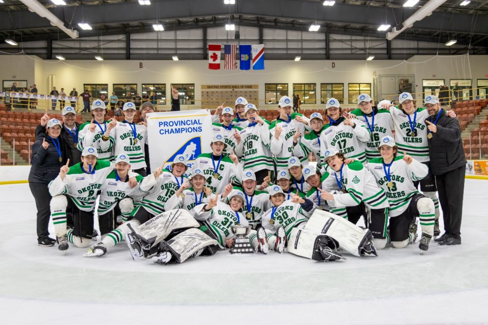 The Okotoks U17 AAA Oilers pose with the banner after winning the Hockey Alberta U17 AAA Provincial Championship by a 1-0 score over Fort Saskatchewan on April 9 in St. Albert. (Tim Osborne Photography)