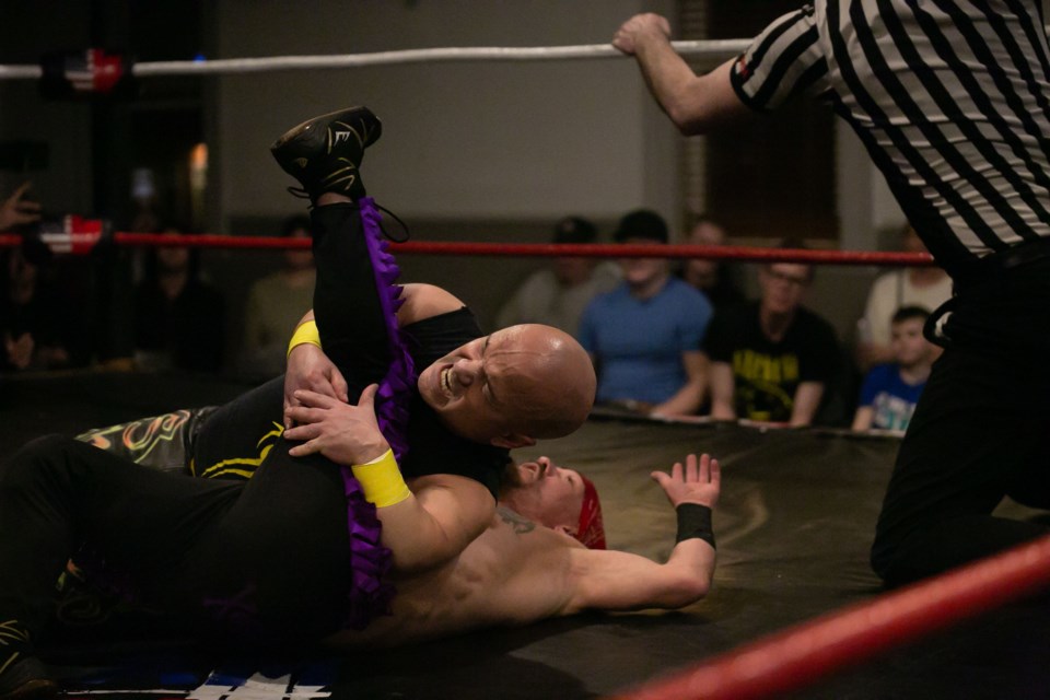 Short Sleeve Sampson takes the Canadian Badass down with a leglock during a CanAm Wrestling card at the Okotoks Elks Hall on Feb. 23. 