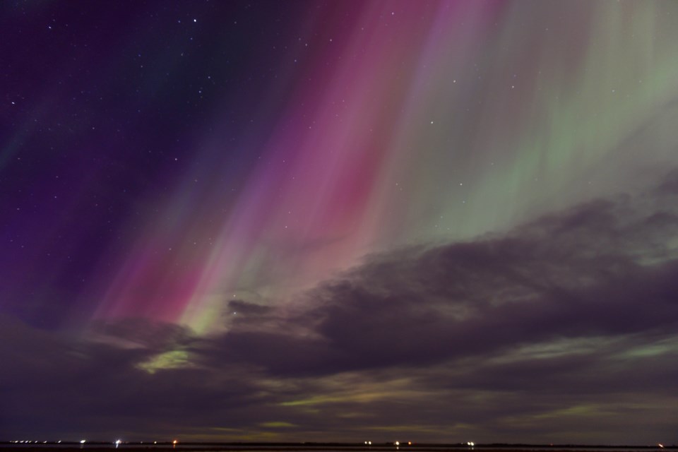 Northern lights light up the night sky at Frank Lake, in Foothills County, shortly after midnight on May 11. The National Oceanic and Atmospheric Administration (NOAA) Space Weather Prediction Center says there could be a good chance to see the lights overnight on July 29.