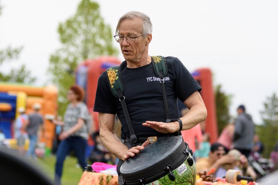 Don Wilhelm, with YYC Drum Circles, plays a hand drum during the Diamond Valley Discovery Day Family Festival at Millennium Park in Diamond Valley on June 1.