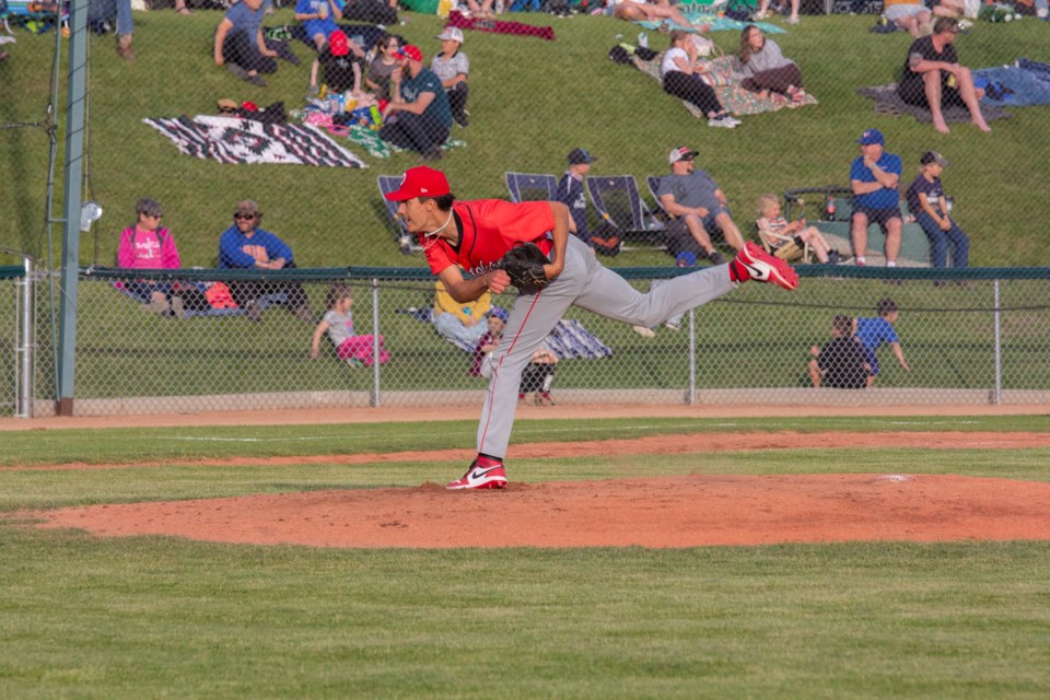 Okotoks Dawgs pitcher Brody Forno throws during a match against the Edmonton Prospects on route to a 7-2 victory in WCBL action at Seaman Stadium on June 13. Due to renovations at their own stadium, the Prospects were the home team for the game.