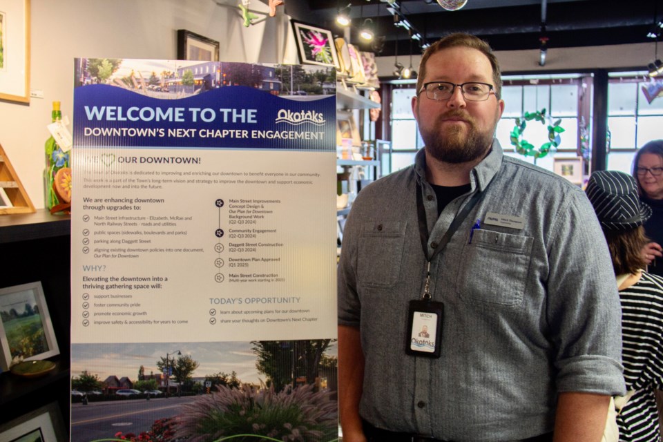 Mitch Thompson, senior engineer with the Town of Okotoks, at the downtown redevelopment open house held at the Okotoks Art Gallery on June 18.