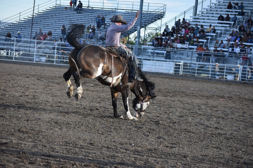 Okotoks' own Sam Weston competing in the Saddle Bronc at the Pro Rodeo Canada Guy Weadick Rodeo 2024 at the High River Agricultural Society grounds.