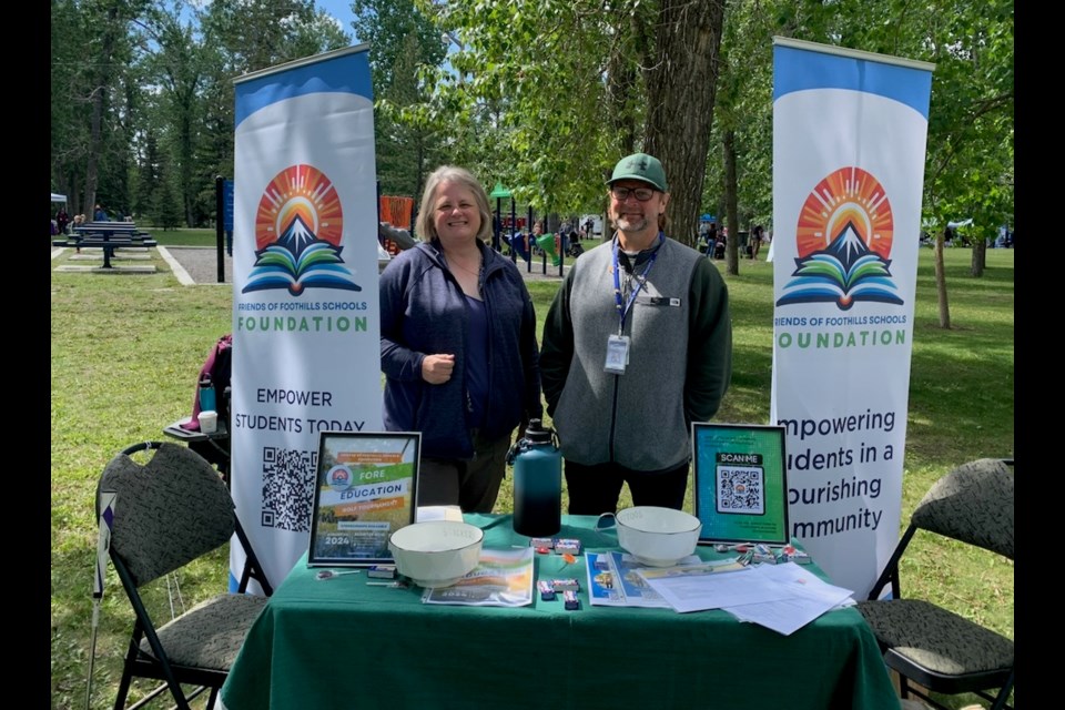 Foothills School Division trustee Lisa Penzo and superintendent Dr. Christopher Fuzessy raise awareness about the Friends of Foothills Schools Foundation during Picnic with a Purpose last month at George Lane Park in High River. 