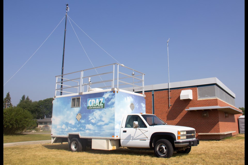 The Calgary Region Airshed Zone Society will be collecting air quality data in Okotoks through a portable air monitoring laboratory, located in this vehicle, photographed on Aug. 8, stationed in the bus loop between Okotoks Junior High School and Percy Pegler School.