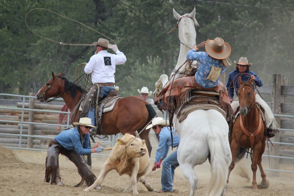 Contestants take part in cattle roping at the Bar U Ranch Old Time Ranch Rodeo on Aug. 20, 2017.