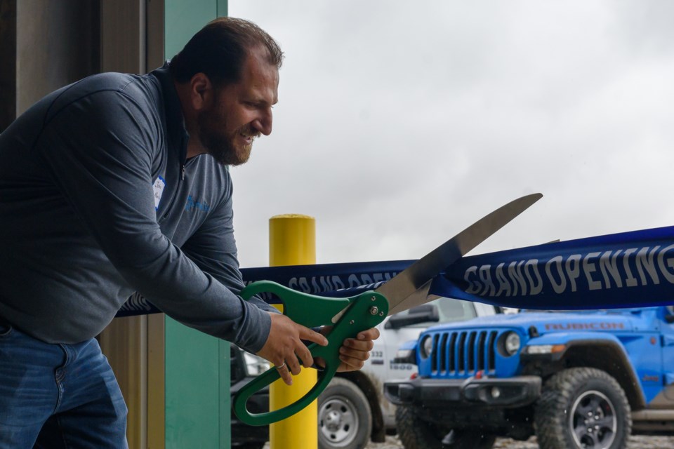 General Manager John Markiw cuts the ribbon at the grand opening for Catapult Environmental's Aldersyde Organics Resource Facility in Foothills County on Sept. 12.