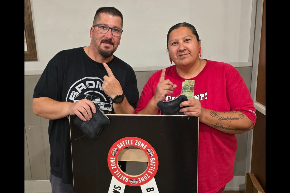 Okotoks Prairie Dogz co-director Steve Wilson (left) and Henry Giroux pose after winning first place at a competition on Sept. 19.