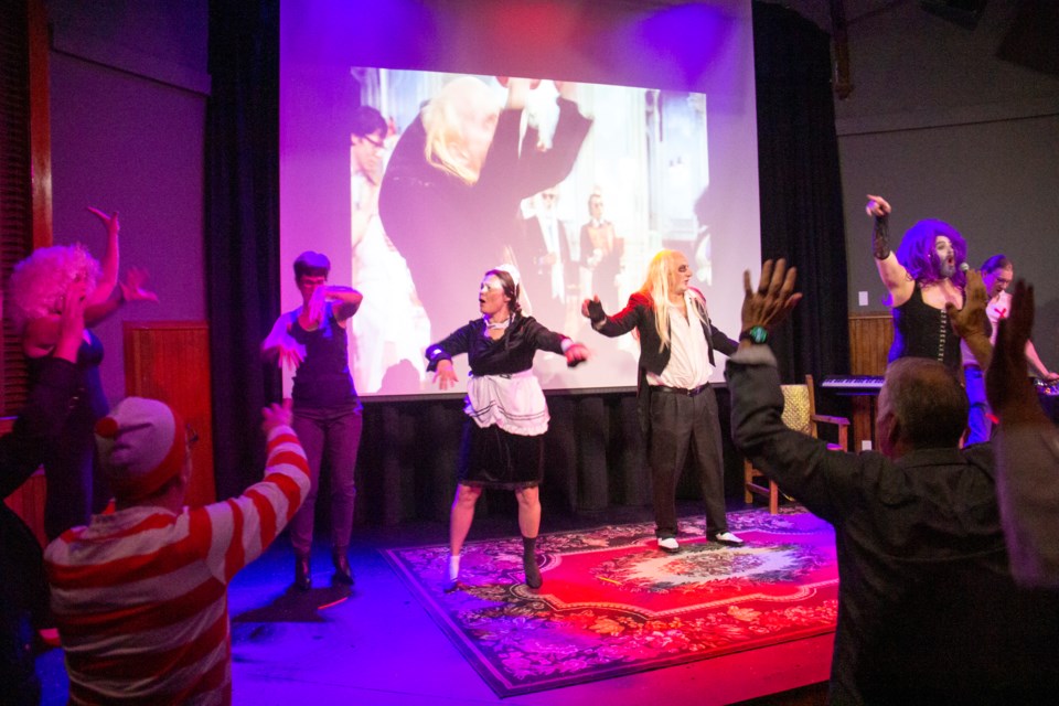 Audience members do the Time Warp during a screening of 'The Rocky Horror Picture Show' at the Old Church Theatre in Okotoks on Oct. 5.