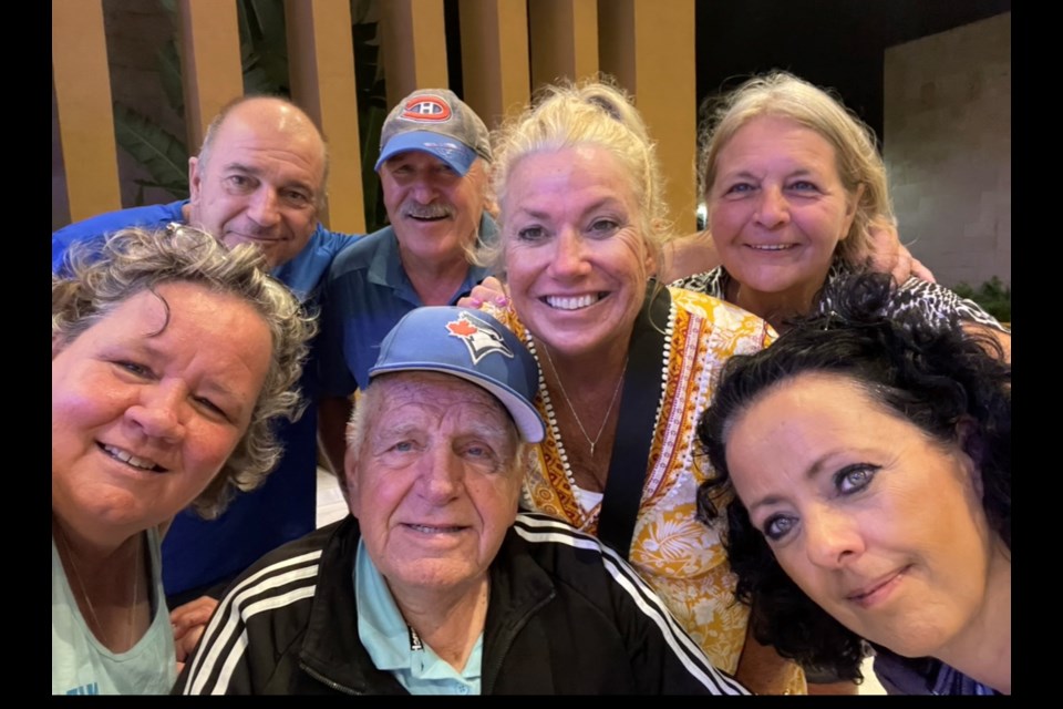 Michael Steele, back row, second from left, and Viktoria Steele, back row, far right, pose for a photo with other Canadians after riding out a hurricane together at a resort near Varadero, Cuba, on Nov. 6.