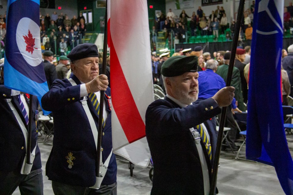 The colour guard enters during the Remembrance Day service held in Okotoks at the Viking Rentals Centre on Nov. 11.