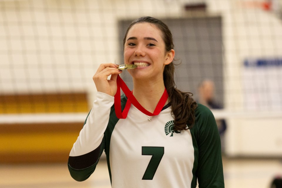 Strathcona-Tweedsmuir School Spartans captain Georgia Stragemann poses with her gold medal after winning the Foothills Athletic Council senior girls volleyball tournament on Nov. 6.