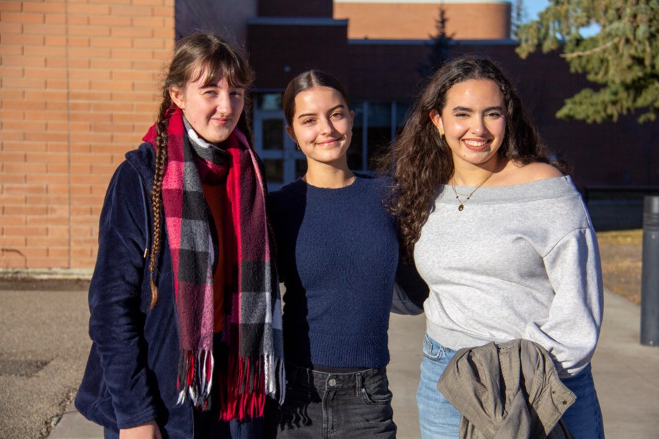 French exchange students were welcomed to Okotoks and High River through an exchange between Foothills School Division and the Nancy-Metz academic region in northeastern France. From left are Diane-Laure Evrard (Jean Paul II, Bar-le-Duc), Layleen Frantz (Jean Victor Poncelet, Saint-Avold) and Nora Hayouni (Jeanne d'Arc, Nancy), pictured at Foothills Composite High School on Nov. 7.