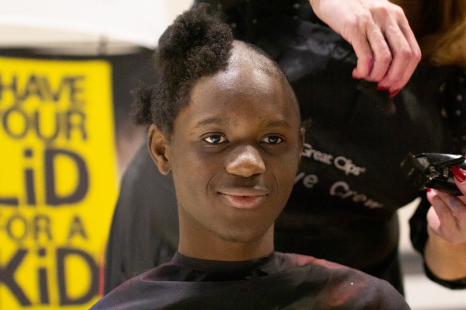 Claude Alex Soro, a Grade 11 student at École Beausoleil in Okotoks, took part in Kids Cancer Care's Rock Your Locks campaign on Nov. 15 by shaving his head.