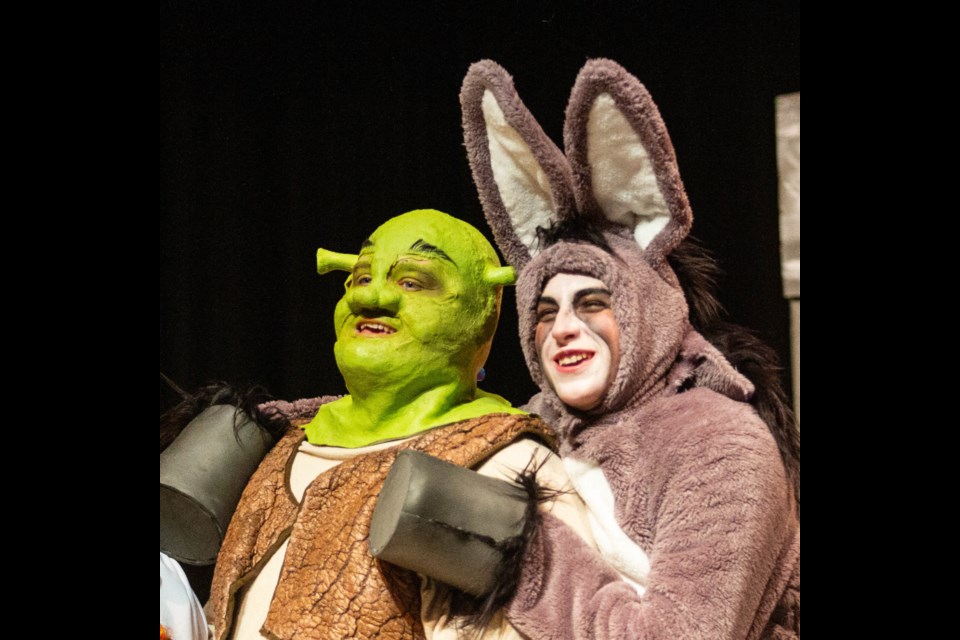 Tyson Walker as Shrek and Barrett Duxbury as Donkey on-stage during the Windmill Theatre Players' production of 'Shrek the Musical' at the Highwood Centre in High River.