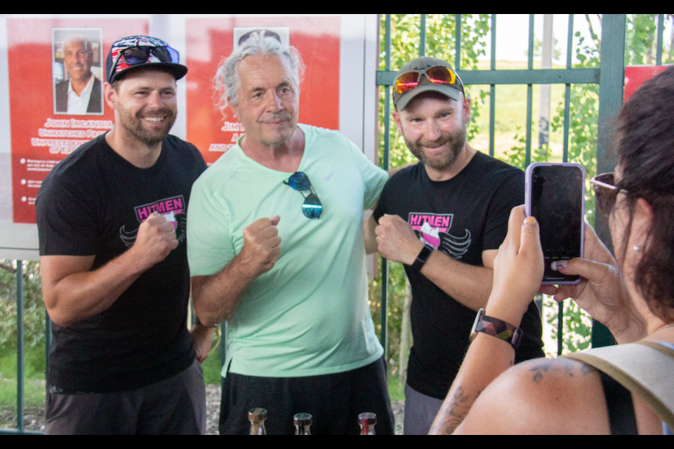 Bret Hart poses for a photo with a fan at Seaman Stadium on July 19.