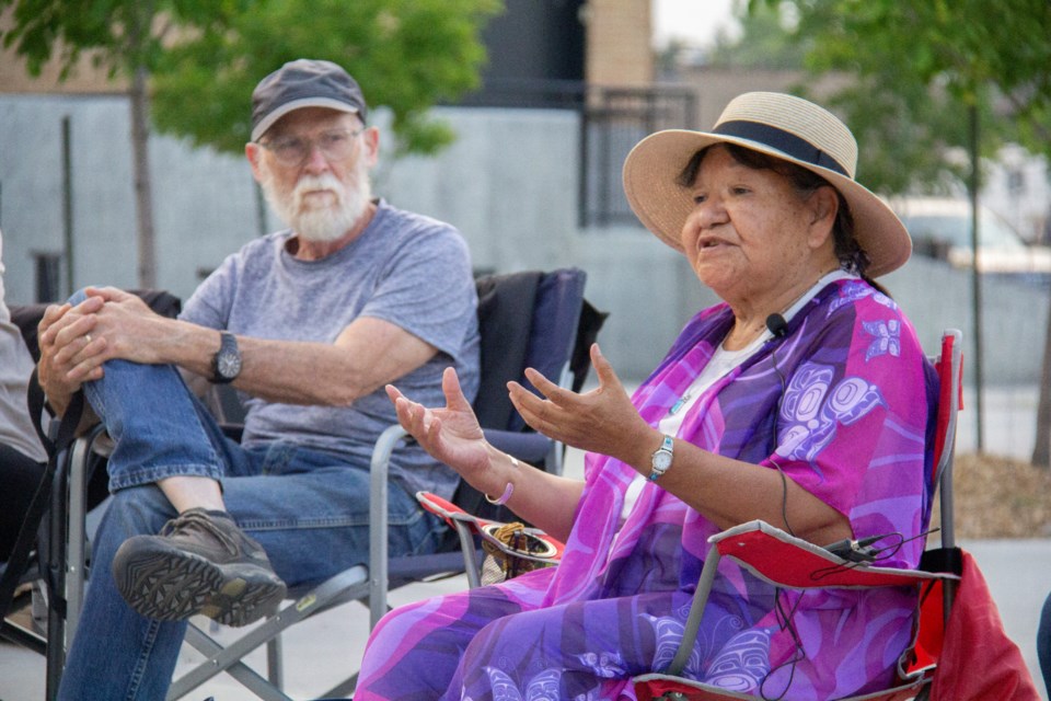 Elder Shirlee Crow Shoe, whose Blackfoot name is Misamiinisikim or Ancient Buffalo Stone, speaks during the Fireside Stories event in Ethel Tucker Centennial Park on July 19.