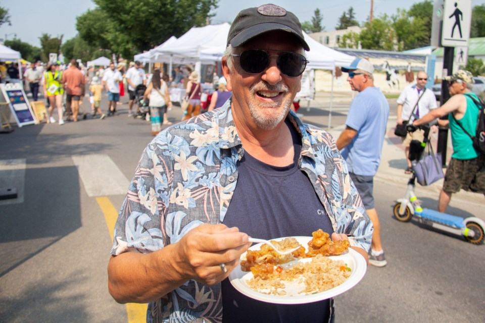 Barry Aebig enjoys local cuisine during Taste of Okotoks on July 20.