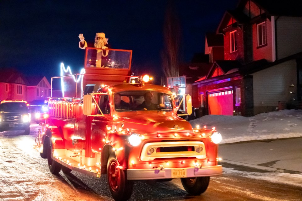 Santa makes his way down Crystal Green Drive in Okotoks on Dec. 24 during the annual Santa’s Christmas Eve Parade.