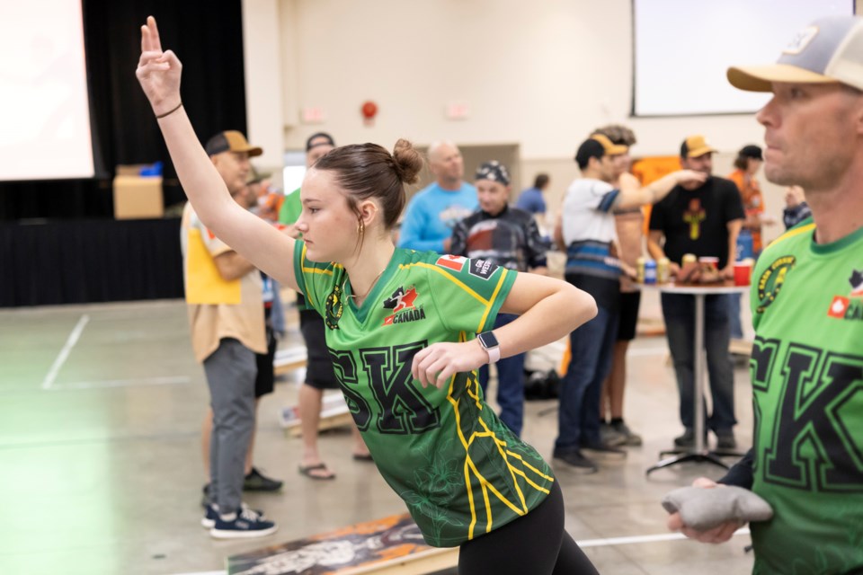 Sask Cornhole League players Glen (right) and Presley Boehme, hailing from Regina, play cornhole during the Alberta regional tournament hosted by the Okotoks Prairie Dogz on Jan. 11.