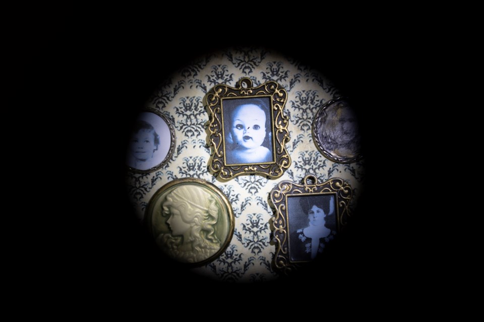 Creepy imagery is a major element of Lori L. Lofgren's exhibit 'The Investigation' at the Okotoks Art Gallery, as seen in one of her miniatures only visible through a peephole.