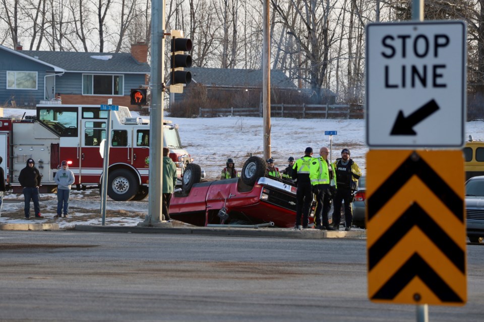 A rollover accident caused long traffic backups leaving Okotoks at the intersection of Hwy. 2A and 338 Avenue on the morning of Jan. 28.