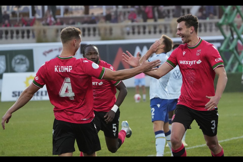 Cavalry FC Daan Klomp, left, celebrates a goal by teammate defender Callum Montgomery during Canadian Premier League soccer action against the Halifax Wanderers at ATCO Field in Calgary, AB on Oct. 12. The Cavs 2on by a 2-1 score. (CPL Photos/Kevin Udahl/CFC Media)