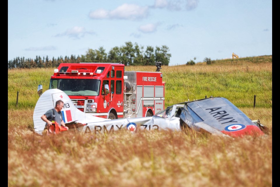 Emergency crews respond to a plane crash east of Black Diamond on Aug. 17. (Brent Calver/Western Wheel)