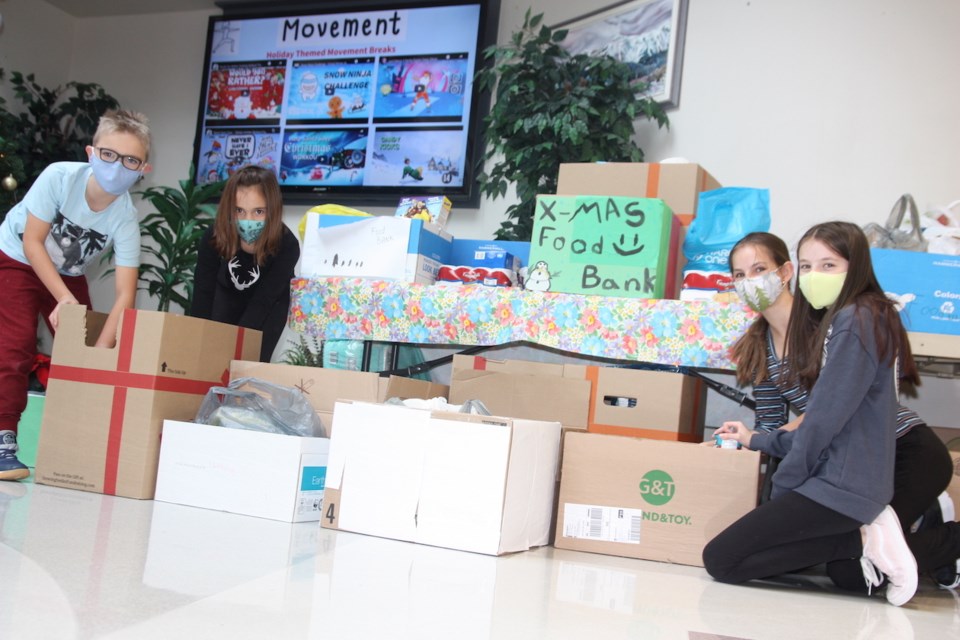 Okotoks elementary school helps food bank, high school - Okotoks ...