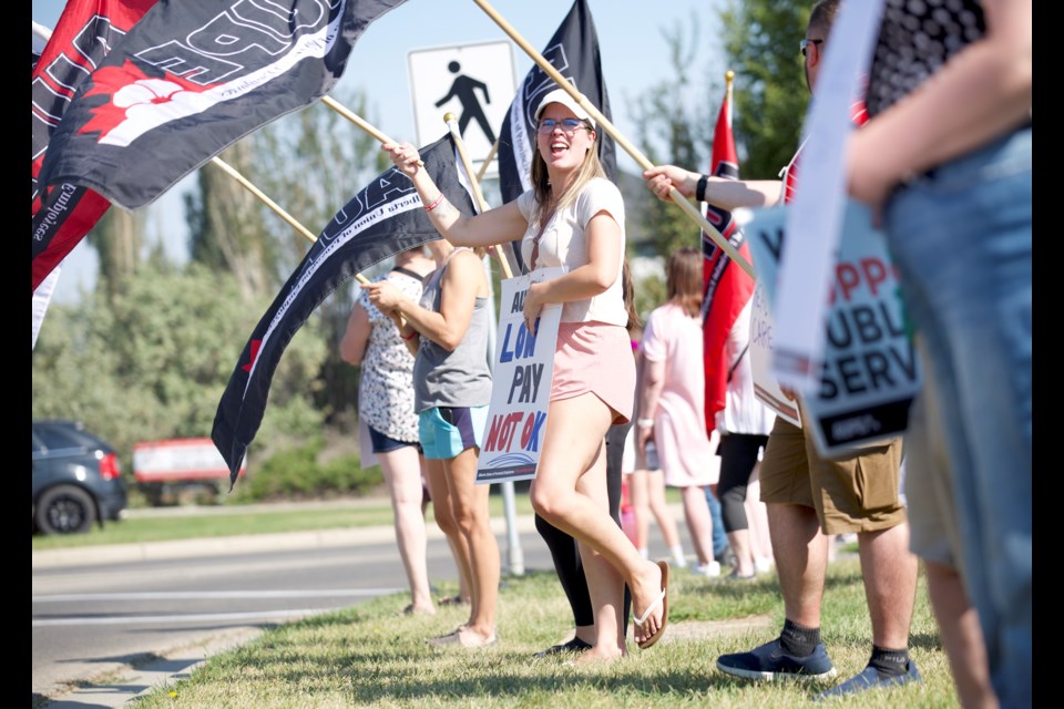 The Alberta Union of Provincial Employees (AUPE) held a rally in Okotoks on Sept. 8 to push for better wages, job security, working conditions as part of an organized effort across the province. 