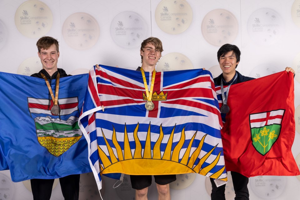 Foothills Composite student Tom Wyzykoski, left, won bronze in the electronics competition at the Skills Canada National Competition, held May 30-31 in Quebec City.