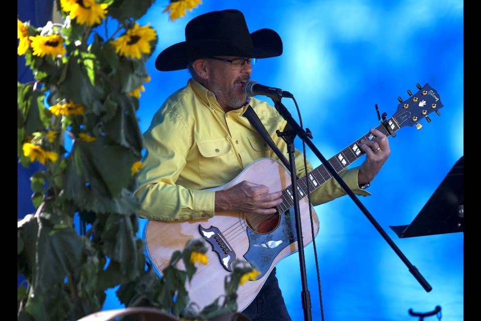 Musician Tom Donnelly, celebrating his birthday, entertains the crowd at the 15th annual Davisburg Turkey Supper on Oct. 6.