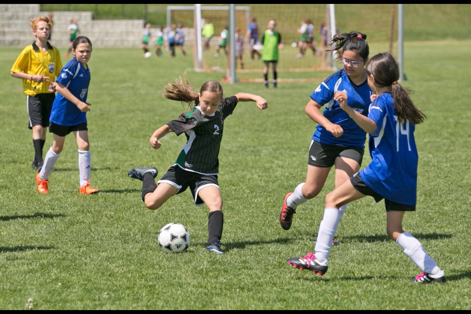 Okotoks United Soccer players compete in a past Okotoks jamboree event at the Bill Robertson Park. The 2023 Okotoks Jamboree presented by Cavalry FC will run June 16-18 with the Canadian Premier League club joining on as a sponsor of the event. (Remy Greer/Western Wheel File Photo)