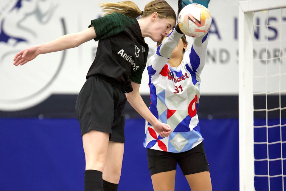 Okotoks United’s Charlie Burnham goes for a header on a corner during the gold medal game of the U15 futsal Tier 2 division at the Cavalry FC Regional Field House. Okotoks won on penalty kicks after scoring the equalizer in the final 14 seconds.