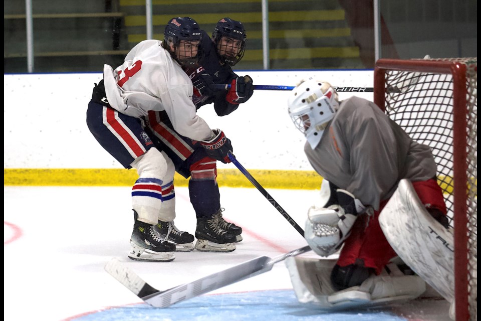 Jakob Semeniuk and Avery Greig battle during the Carstar Okotoks Bisons main camp on Sept. 7 at the Murray Arena. Okotoks plays in Heritage Junior Hockey League exhibition action on Sept. 13 versus the visiting Strathmore Agra Risk Wheat Kings.