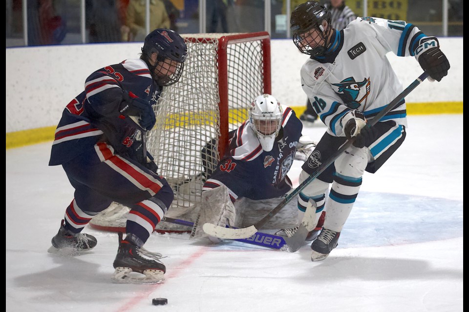 Carstar Okotoks Bisons goalie Connor White tracks the puck during the 4-0 win over the Sylvan Lake Wranglers in Heritage Junior Hockey League action on Dec. 6 at the Murray Arena. White made 27 saves for his first shutout with the herd.