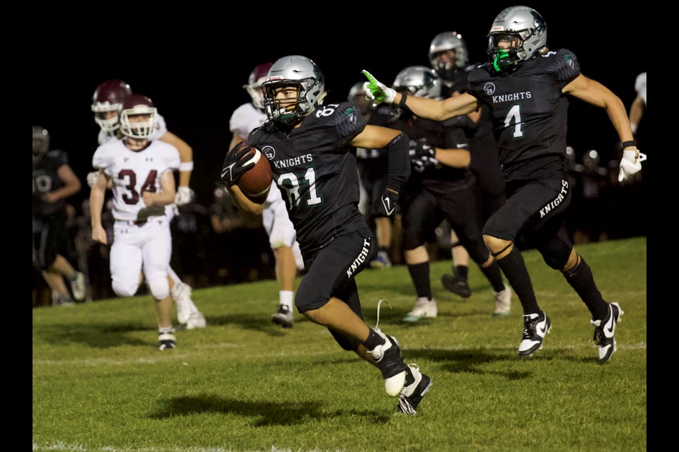 Malik Robbins returns a kick for the HTA Knights during the 60-7 win over the Foothills Falcons in the high school football clash Sept. 19 in Okotoks. 