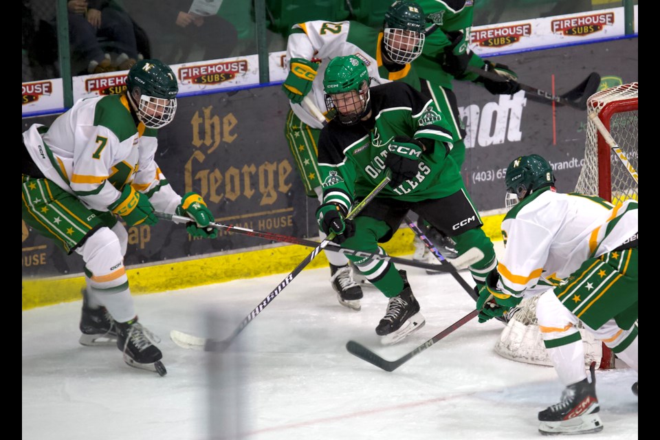 Jake Rogers of the Okotoks Bow Mark Oilers battles for the puck behind the net during the team’s 6-5 win over the Calgary Northstars in Alberta Elite Hockey League U18 AAA action on Nov. 24 at the Viking Rentals Centre.