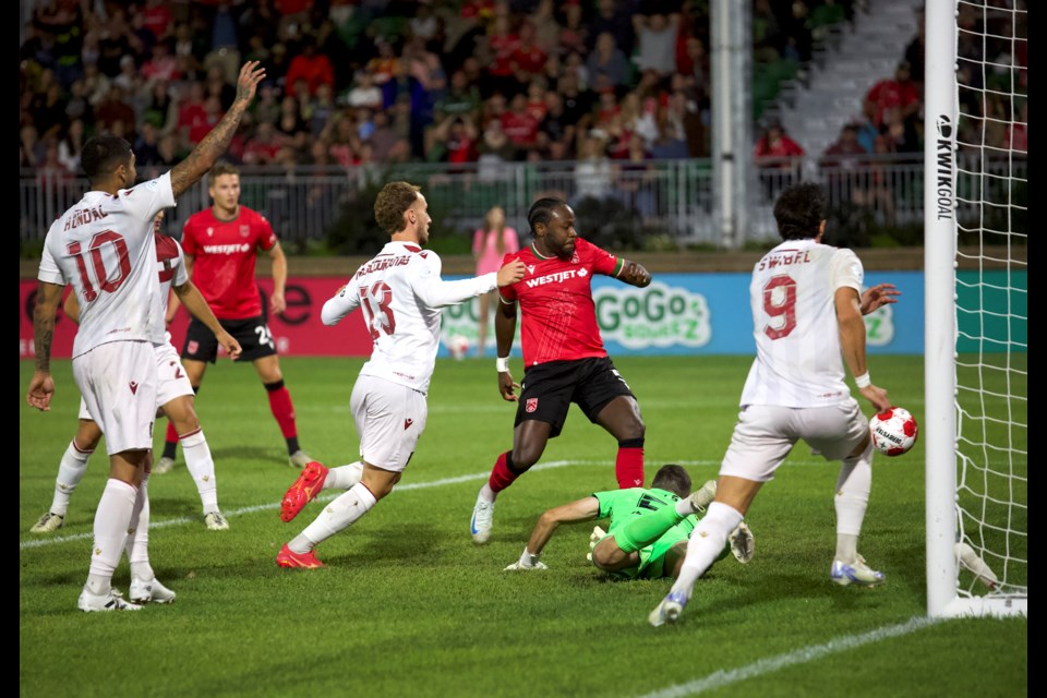 Cavalry FC left back Bradley Kamdem gets the final touch for the opening goal, his first with the club, in the 2-2 draw with Valour FC on Aug. 30 at Spruce Meadows’ ATCO Field. 