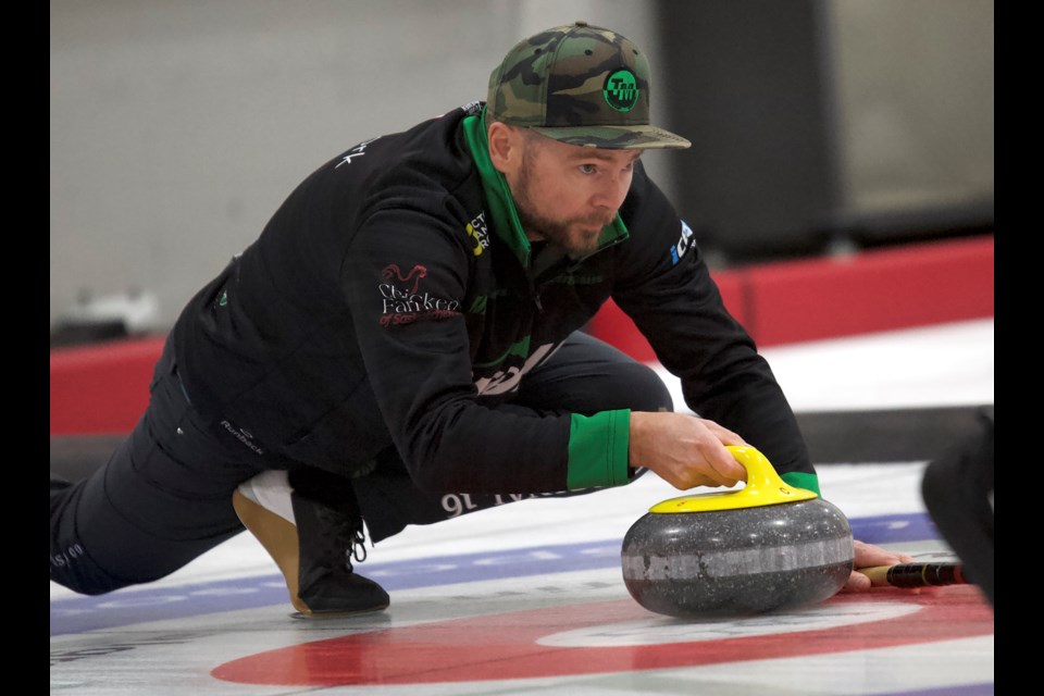 Team McEwen skip Mike McEwen throws the last stone in the final of the 2024 ATB Okotoks Classic. The Saskatchewan team bested Team Shuster 5-2 in the final, Sept. 22 at the Okotoks Curling Club.