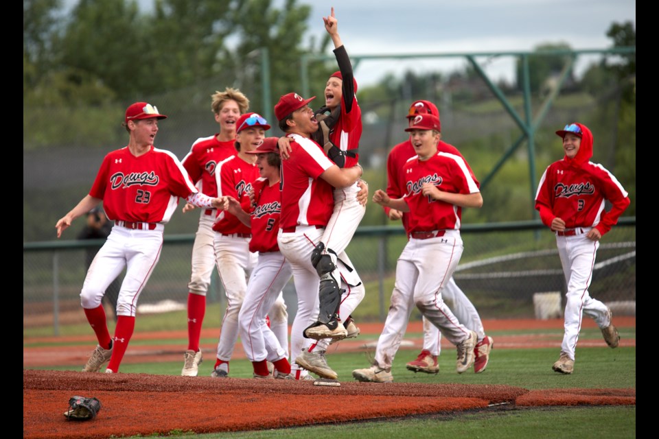 The Okotoks Dawgs 15U Black squad celebrates its 10-2 victory over the UBC Thunder in the gold medal game of the Canada Day Classic Tournament on July 1 at Tourmaline Field.