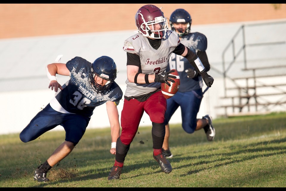 Foothills Falcons quarterback Emerson Liepert finds running room during the 28-12 win over Calgary’s Bishop O’Byrne Bobcats on Sept. 13 at Falcons Field. Liepert had two rushing touchdowns and one passing touchdown in the victory.