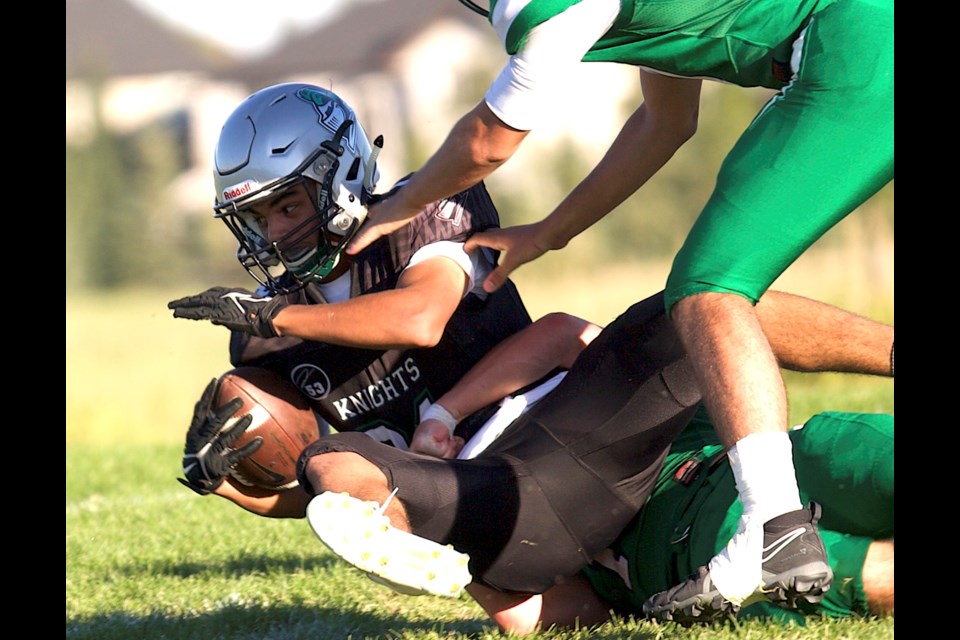 Malik Robbins, pictured making a reception earlier this season, and the Holy Trinity Academy Knights take on Airdrie’s W.H. Croxford Cavaliers on Nov. 1 in Cochrane to start the playoff slate.