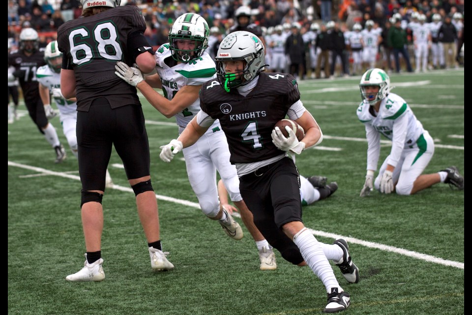 Holy Trinity Academy Knights wide receiver Ben Gutek breaks tackles and works his way down field during the 44-10 win over the Medicine Hat High Hawks in the Football Alberta 4A provincial quarter-final on Nov. 9 at Calgary’s Shouldice Park.