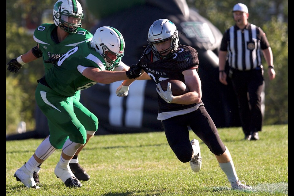 Holy Trinity Academy Knights runningback Seth Poelzer breaks free for a big run during the 53-10 win over the Medicine Hat High Hawks on Sept. 6 in Okotoks. 