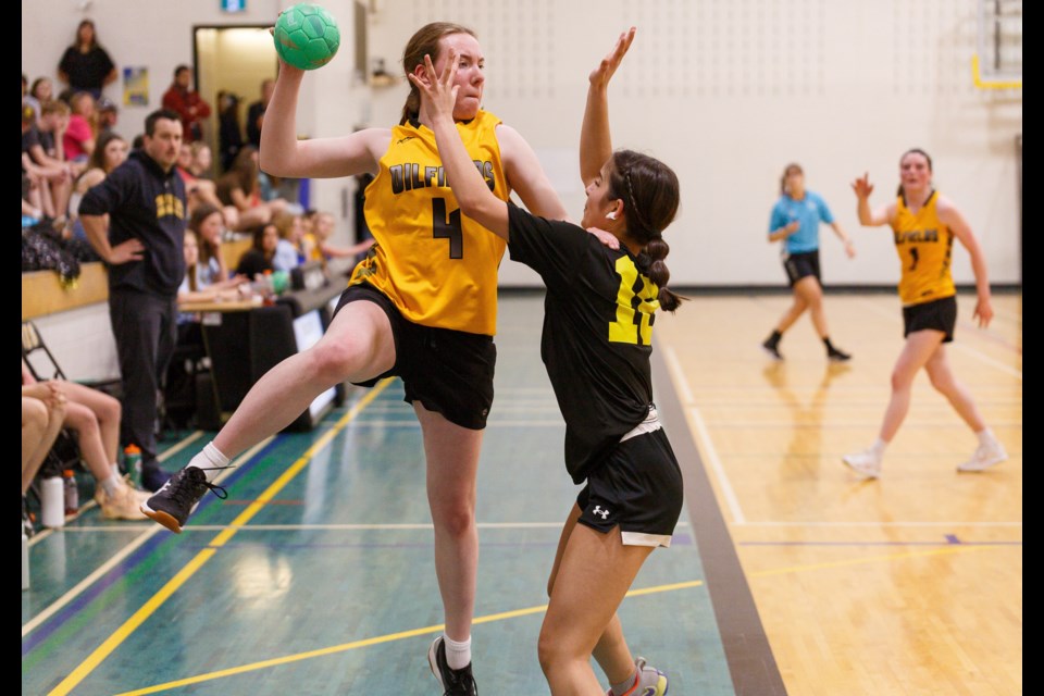 Oilfields Driller Ella Hamilton evades a Two Hills defender during the ASAA Team Handball Tier II Provincial Championships in Diamond Valley on May 10. Oilfields won the consolation title in both the girls and boys divisions.
