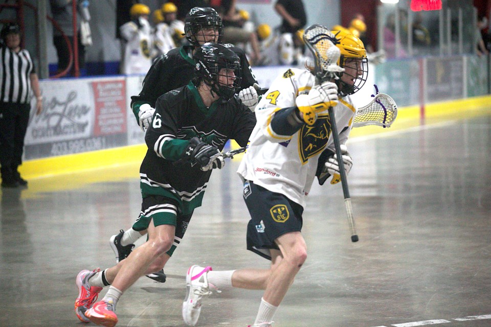 Okotoks Marauders Blake Robinson and Lucas Harlow defend during the 17-5 victory over the Mountain View Mavericks in Rocky Mountain Lacrosse League Jr. B Tier I action on June 11 at the Murray Arena. 